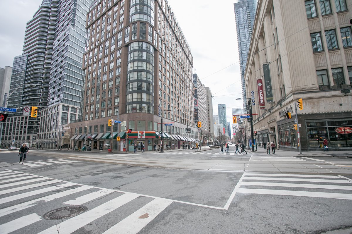 blogTO's tweet photo. Yonge St. in downtown Toronto is almost totally deserted right now https://t.co/Em8mDFwI1U #Toronto #SocialDistancing https://t.co/ugHsBHqHl9