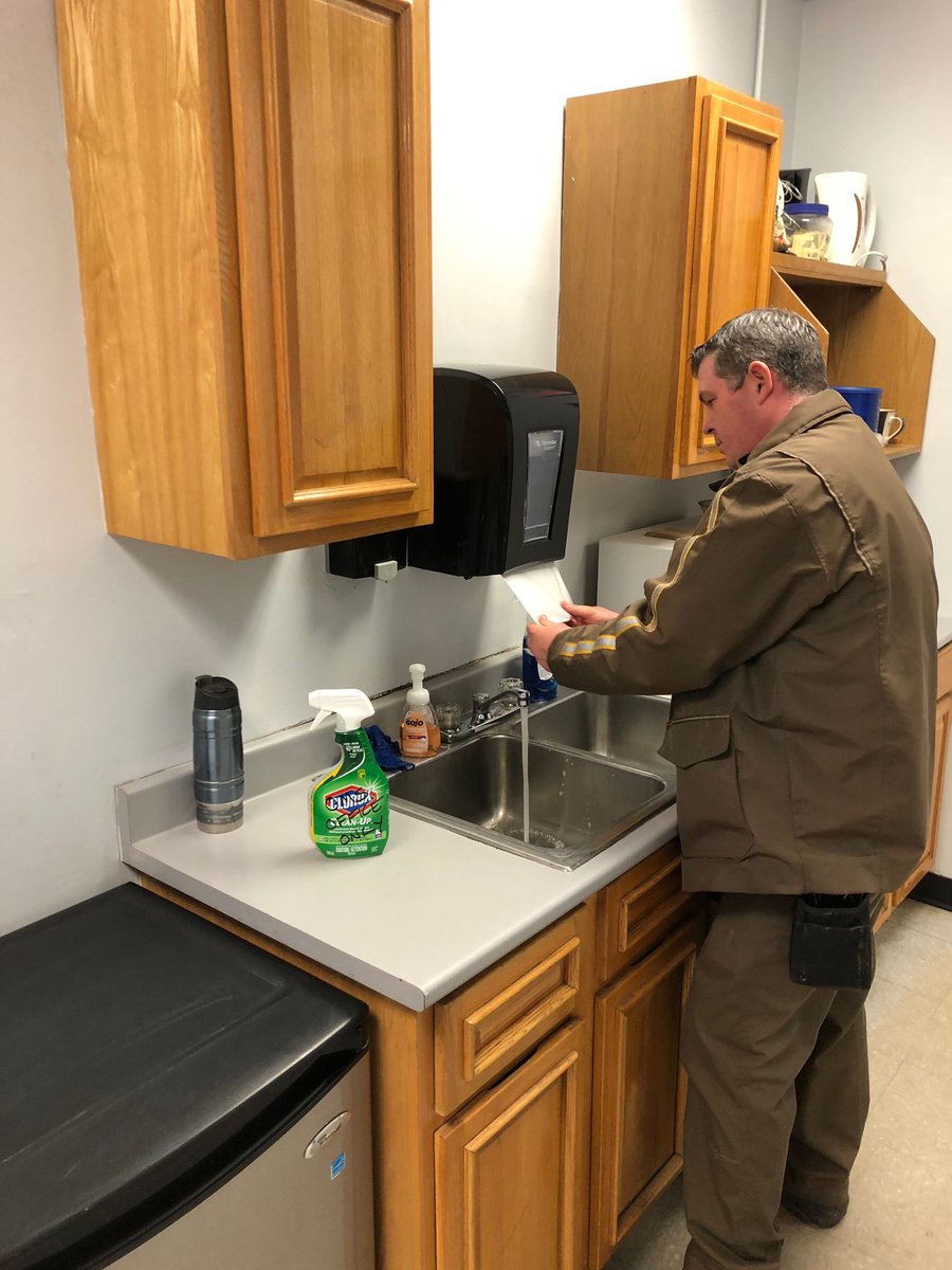 UPS Moncton Centre employees Brad, Gina and Travis doing their part to keep things clean and sanitized during the Covid-19 pandemic.