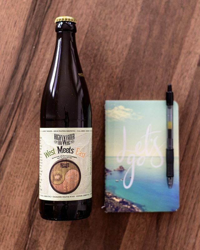 Afternoon beer and planning our getaway for when this mess blows over. West Meets East is an Ale brewed with kiwi and kumquat then aged in wine barrels for one year. #craftbeer #sundaybeer #sourale #westmeetseast #highwaterbrewing #fruitedsour #fruitbeer #craftbeerstagram #c…
