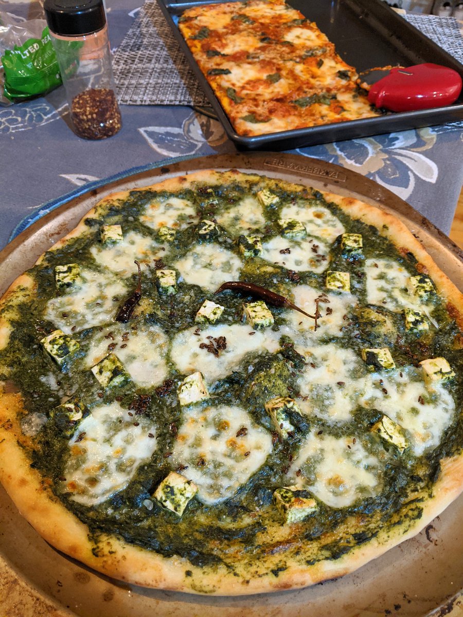 PIZZA NIGHT!grandma ish pizza - simple homemade tomato sauce, fresh mozz, parm, basil, garlic evoopalak paneer pizza - homemade white sauce, layered with palaak paneer, fresh mozz, parm, then finished with zeera/laal mirch baghaar/tadka and fresh squeezed lime juice