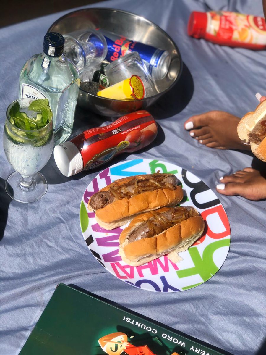 Monday lunch outside, featuring Boerwors rolls, some beverages and board games 