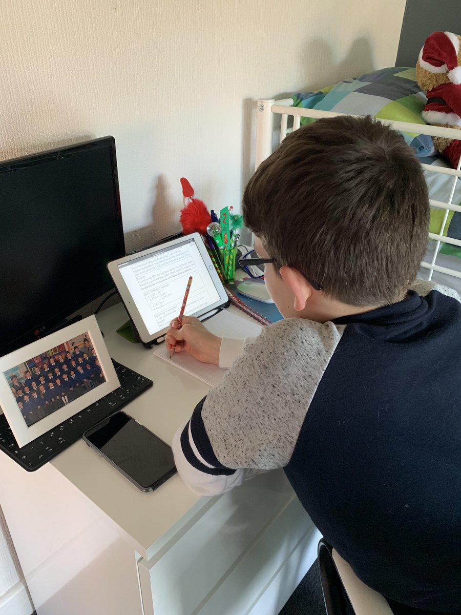 LindseyRowboth2's tweet photo. #alwaysaiminghigh @prestolee_1911 Jesse is making his way through today’s online learning and decimal number workpack. He has his class with him at his workstation. Take care everyone ❤️ https://t.co/bD1aJKEhiC
