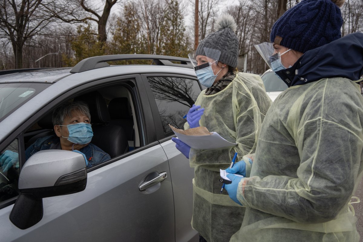 Allen AgostinoNurses Sandra Dickson, right, and Rebecca Wright, centre, screen Mabel King as she boards a ferry returning to Beausoleil First Nation on Friday. The community is restricting ferry access to year-round residents, as the islands are a popular spot for cottagers.