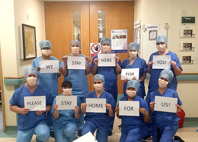 WesternHSCTrust's tweet photo. Our staff in Ward 31, Altnagelvin Hospital sharing the message we cannot share enough. Please stay home and practice #SocialDistancing. Help our staff save lives. https://t.co/CA98dUdiZB