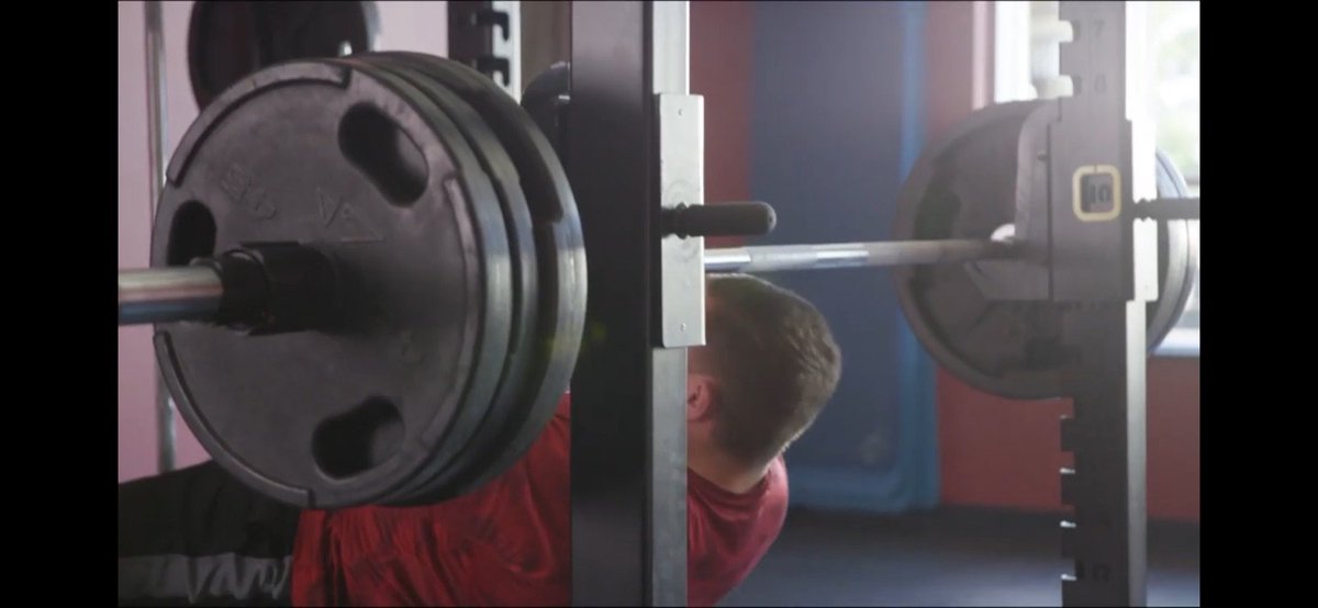 In his "raise the bar" ad, Testin dramatically slides a fourth weight onto the bar. Mysteriously, when he actually lifts it, there are only three weights per side. A ready-made metaphor for not carrying the weight of the consequences of his inaction to prevent in-person voting!
