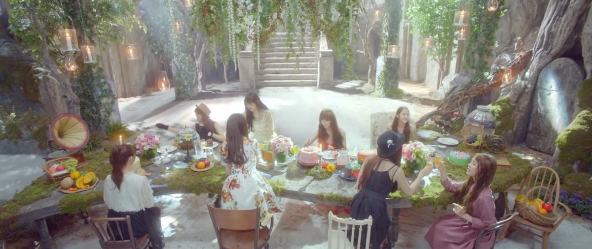 Closer (cont.):After YooA touches ghost Arin's head, there is a table gathering scene. On the table, there are: mango, red apples, white grapes, canteloupe, oranges, blue grapes, bananas, and dragonfruit on display. Also pictured are bell peppers also considered a fruit.