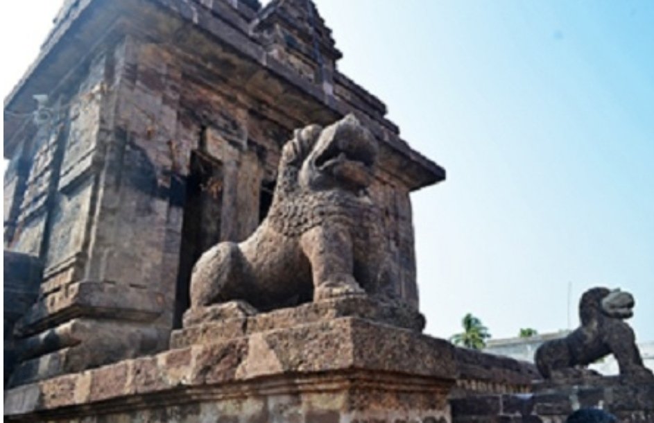 As one enters the premise from the East, a tall golden Dhwajastambha welcomes with depictions of Shiva and Ganesha. A small space, and then one has to ascend few steps to the main arched gate with two lions on both sides of the gates.  @LevinaNeythiri