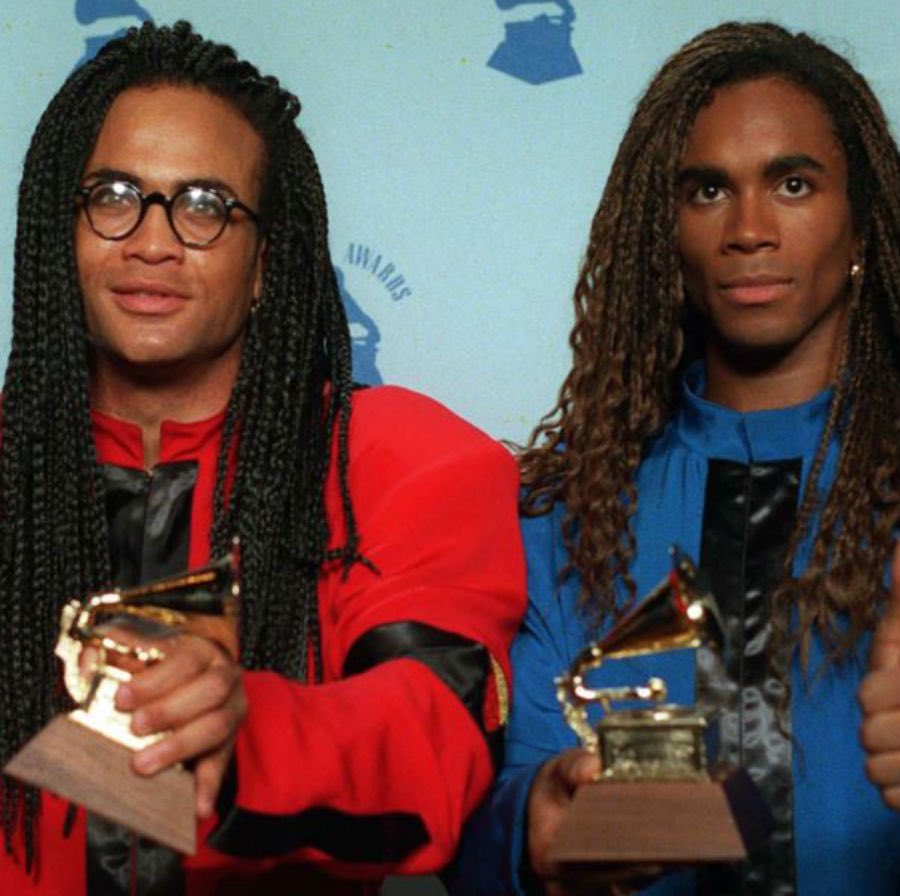 “While these bitches is serving Milli Vanilli on the low” The duo Milli Vanilli was caught lip-syncing to their hit, “Girl You Know It’s True” during the Club MTV Tour in 1989. The duo was later exposed for passing off someone else’s vocals as their own for their entire album.