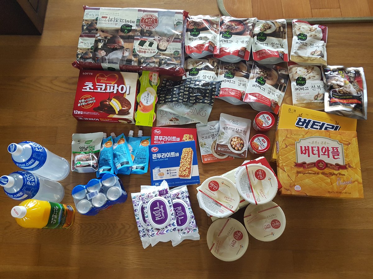 As soon as they arrived home they received a call from their GO to drop off packages with 14 masks, hand sanitizer, thermometer, cleaning supplies, trash bags to avoid contaminating other areas... and food. The amount of food is what really gets me, as does the ChocoPie 정 