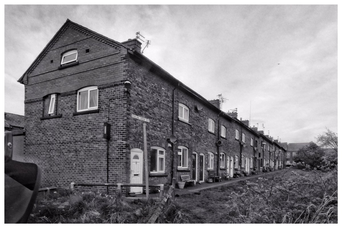 pitheadbaths's tweet photo. Lockdown syndrome has affected my photography, black and white mode today. Miners houses c 1874 at Howe Bridge, Atherton, my junior school at the top end. The mining community is now an architectural conservation area #mininghistory #Atherton #HoweBridge #AthertonCollieries https://t.co/ZCmV7UK171