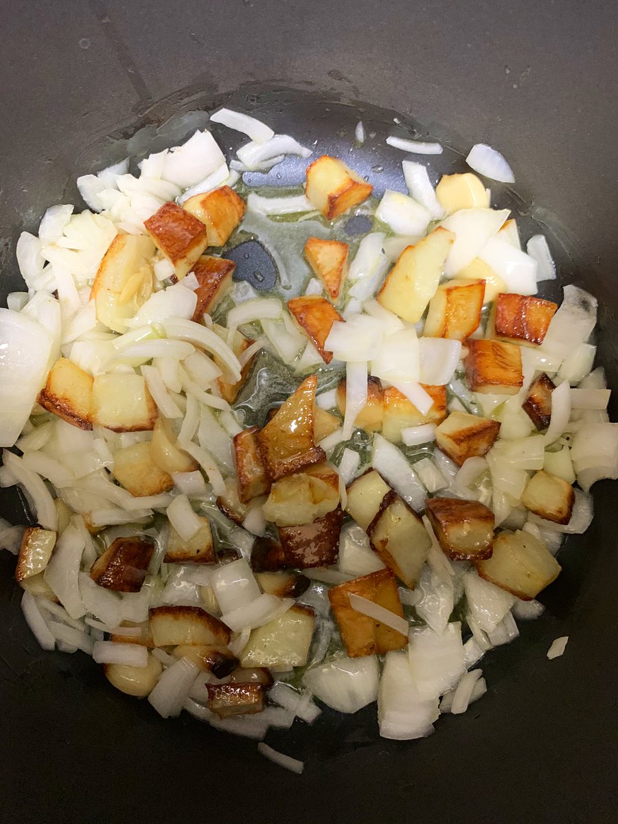 Now my roasted potatoes and 2 heads of roasted garlic gloves (I’ll just leave that autocorrect, as really, wouldn’t roasted garlic gloves be nice?) are simmering with onion, butter, white wine, and salt. Shortly they will acquire some more broth.