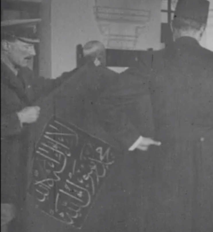 Here is Storrs, son of an Anglican priest, pushing himself into a ceremonial role in a Muslim pilgrimage (1919), mounting the festival's holy banner on its staff. Next to him, the tall figure of mayor Musa Kazim al-Husayni, who Storrs will sack in 1920 after the riots.