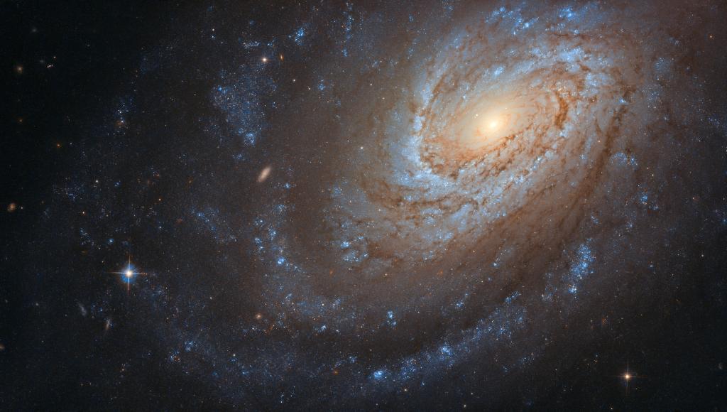 NASA's tweet photo. This spiral galaxy captured by our @NASAHubble Space Telescope may look serene and peaceful as it swirls in the vast, silent emptiness of space, but don’t be fooled — it keeps a violent secret: https://t.co/FPPNlrley0 https://t.co/rVcDhGBnIO