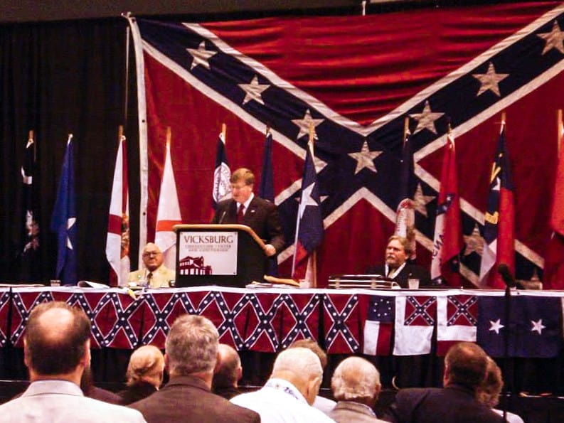 As daily US  #COVID19 deaths hit 1500, Mississippi Gov. Tate Reeves proclaimed April as "Confederate Heritage Month,"  @DonnerKay reports at  @jxnfreepress. SCV, a Neo-Confederate org Reeves spoke to in 2013 (pictured), is hailing the proclamation. https://www.jacksonfreepress.com/news/2020/apr/05/scv-gov-tate-reeves-proclaimed-confederate-heritag/1/