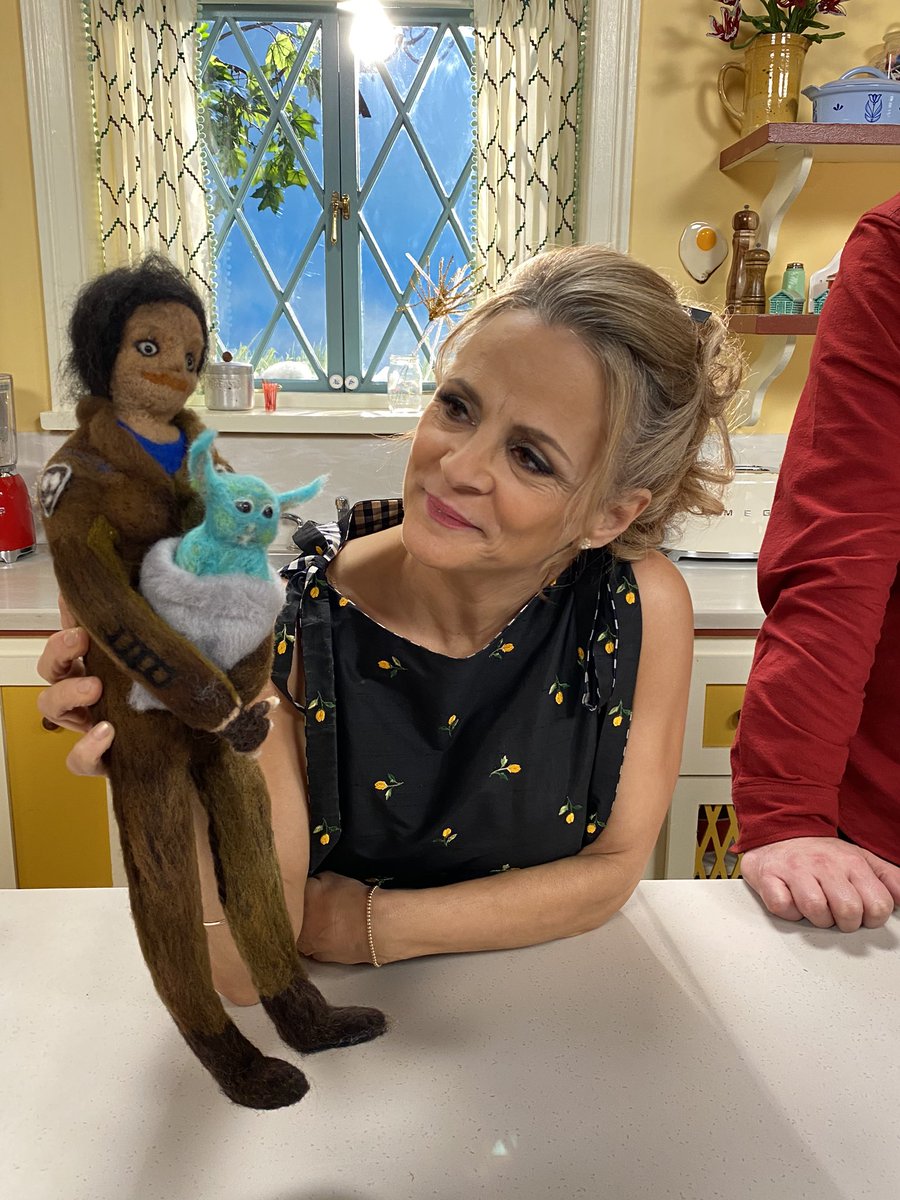 AHWAmySedaris's tweet photo. When @starwars and @athomewithamysedaris collide! Amy on the set of Season 3 with a felt and wool replica doll crafted of her character #PeliMotto and #BabyYoda from @themandalorian, made by friend of the show Marcel Dzama’s father! #CharacterCrossover #AtHomeWithAmySedaris https://t.co/NSIgyWeYpX