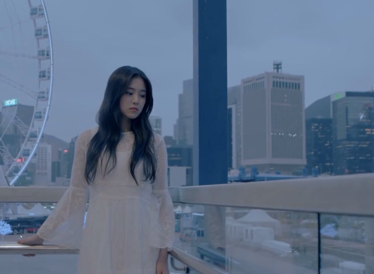 the city skyline is a symbol used in many loona mvs to represent earth. it being shown outside the window can also be representing that yeojin is separated from earth because she is lost in eden.