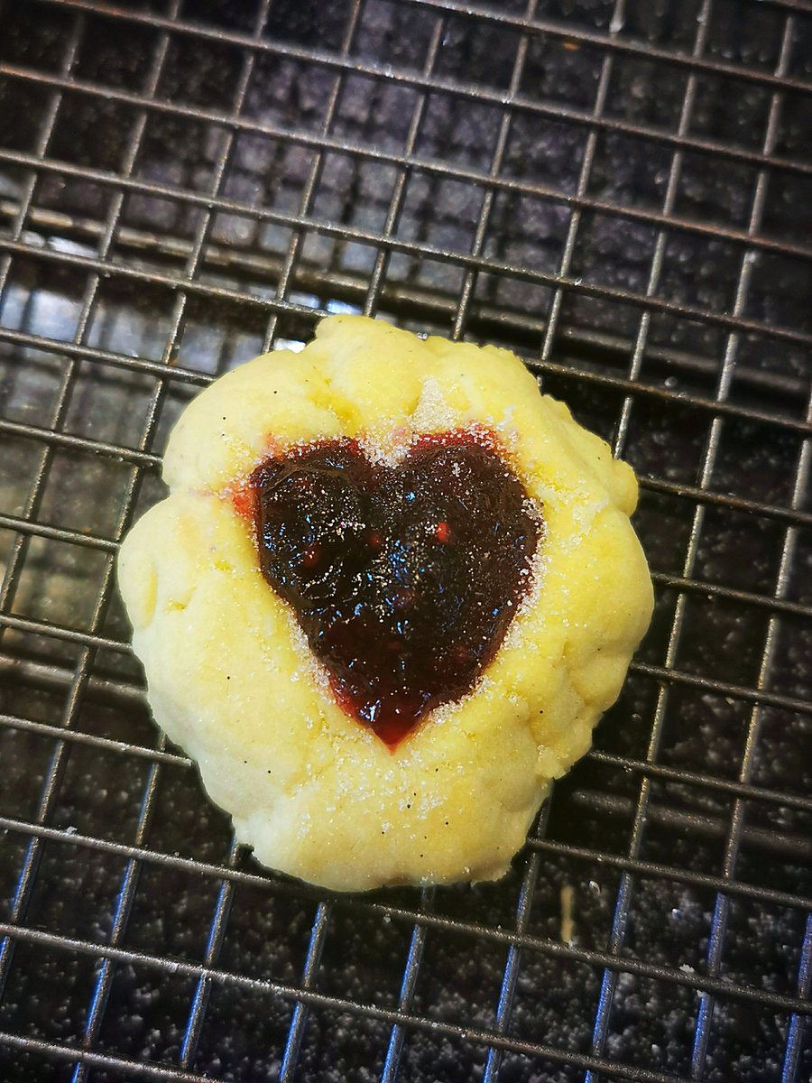 If you made thumb print cookies then carefully fill your thumb print holes with jam, thus.. and then dust them with Caster sugar.