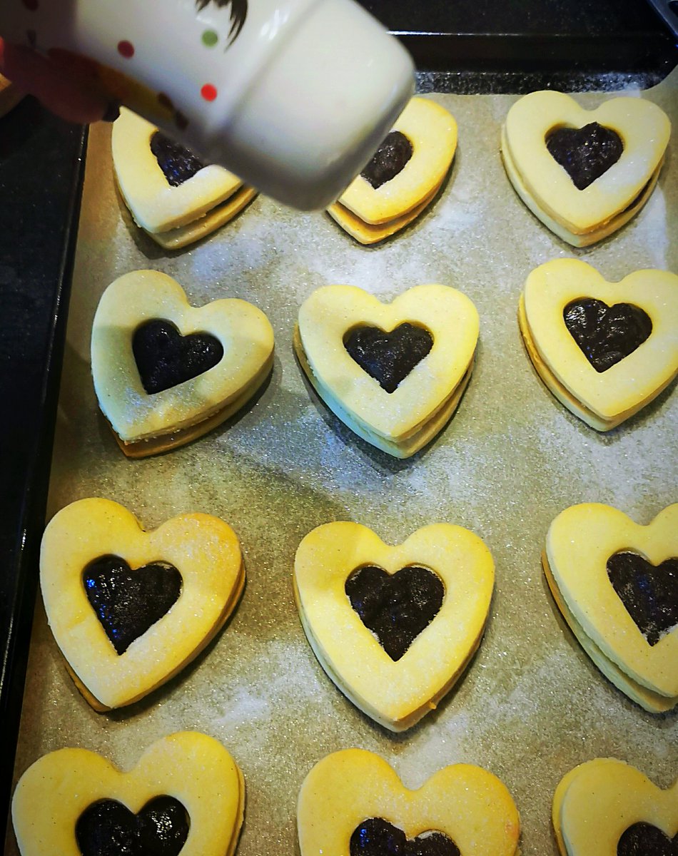 Put your sugar sprinkled Jammie Biscuits back onto a baking tray and pop them in the oven for four or five minutes. This just helps the jam to set.