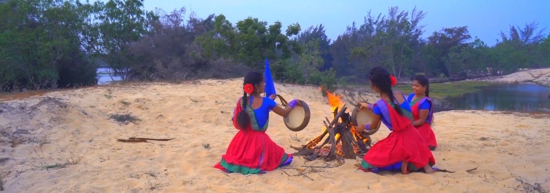 'Zha' 'ழ' - 'Our soil' is a recent song from Eelam produced by Santhors and the Panpaattu Malarchi Koodam of Eelam. Santhors is an Eelam diaspora artist who has worked with Sujeeth G in the past. His songs feature & highlight the Tamil Parai instrument.