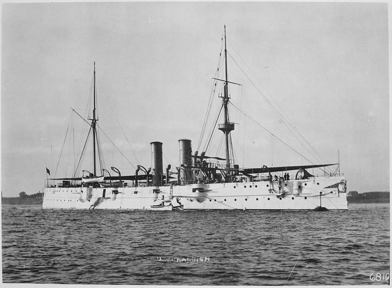This is the cruiser USS Raleigh, credited with firing the first shots in the Battle of Manila Bay, Philippines, during the Spanish-American War. In April 1899, 120 sailors from the Raleigh were toasted at a banquet held for them in the Waldorf-Astoria Hotel.