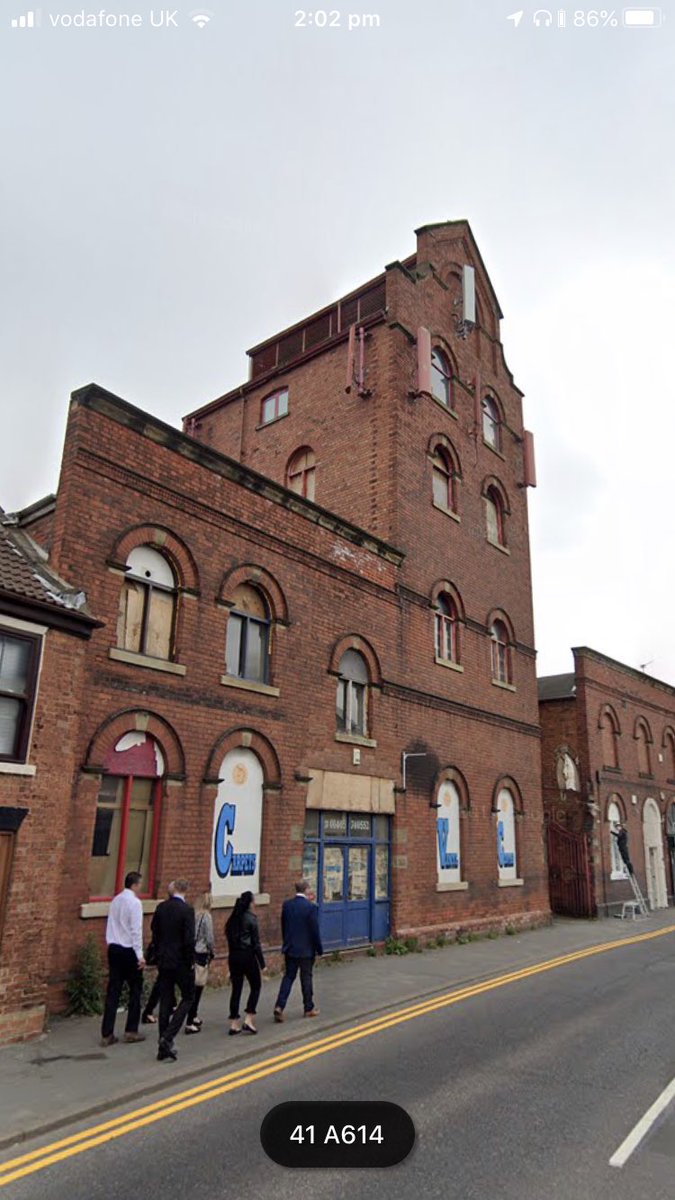 ...but I found the perfect building (photo) and approached the owner. The building was an ex brewery and was a shell. We climbed to the top using three old wooden ladders and no climbing equipment. It would be illegal to do that today. I said it would be fit for...