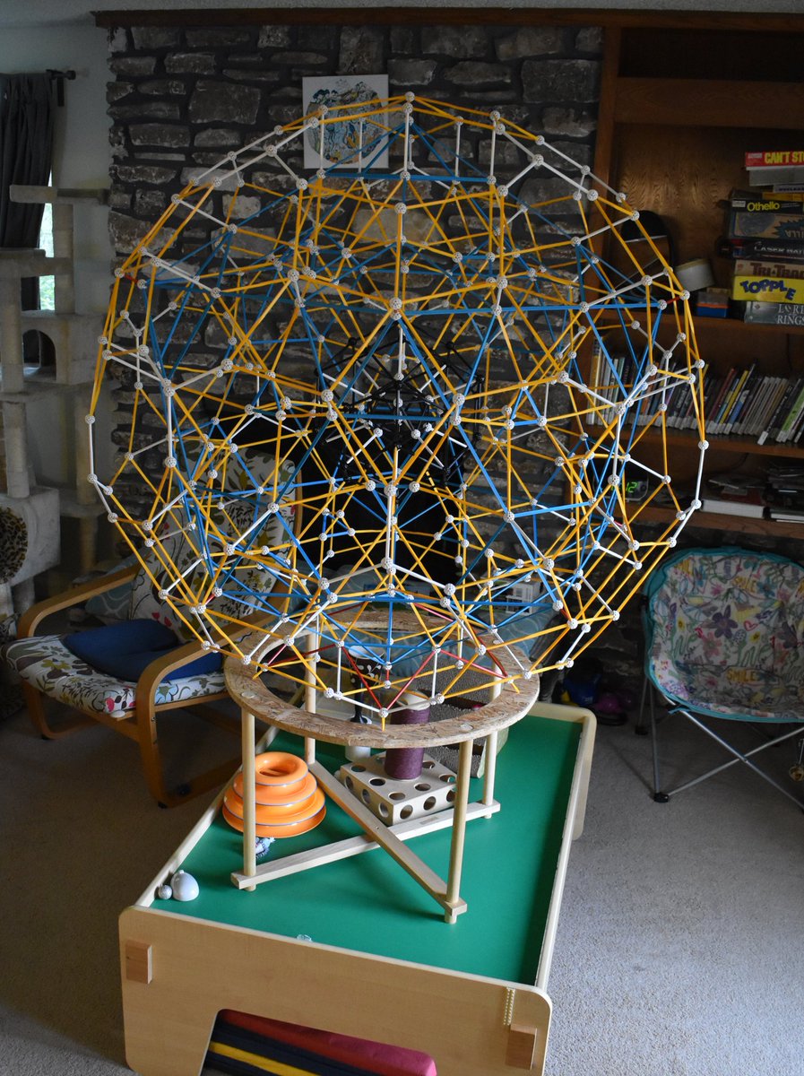 gurzil's tweet photo. Icosahedron > rhombictriacontahedron > truncated icosahedron > 16-zonohedron.  The cats are tentatively allowing this to stand.   @zometool https://t.co/8F0dLZTdyi