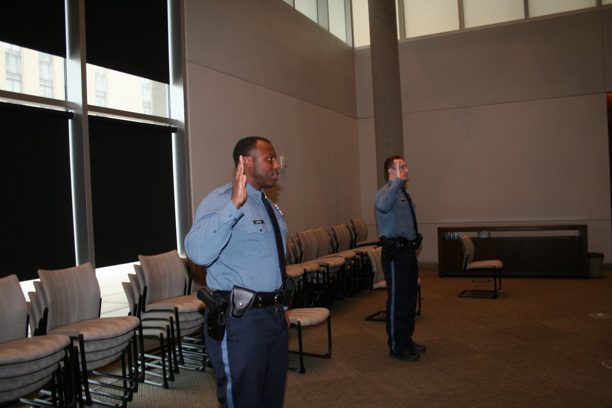 kcpolice's tweet photo. A socially distant swearing-in for our four new lateral-transfer officers today (meaning they were already police officers at other agencies). We need them now more than ever and welcome them to KCPD. https://t.co/icvB0f1LTK