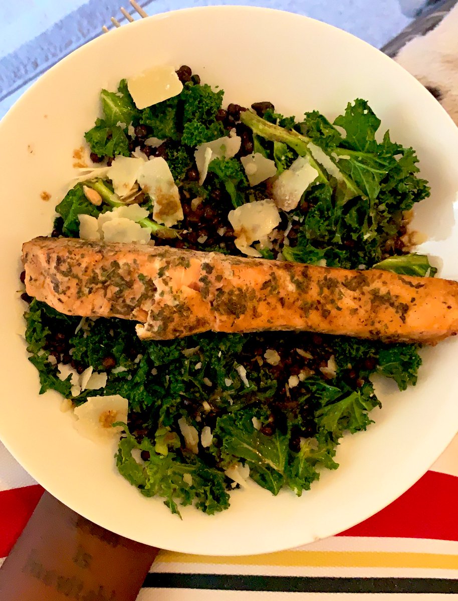 Baked salmon on a bed of kale, puy lentils and parmesan w/ a honey vinaigrette.