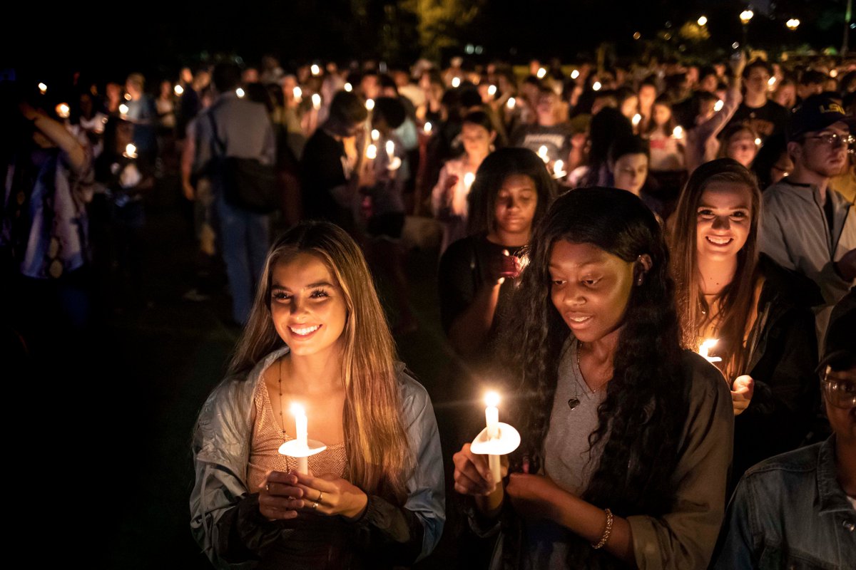 Students hold candles at the LSU Twilight Ceremony during 2019 Welcome Week. Addison Rae Easterling is featured.