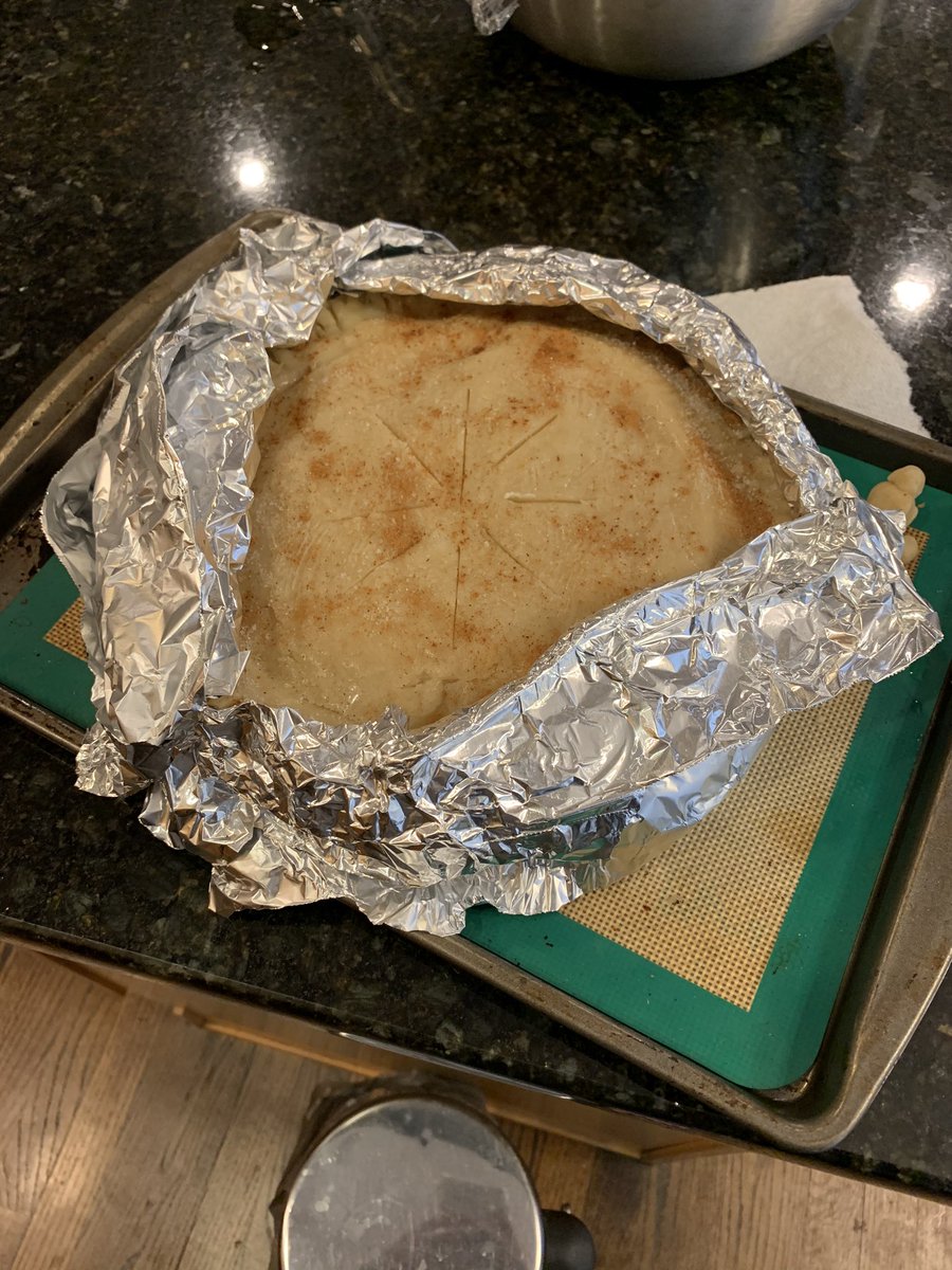 Top your pie with a generous layer of butter (I mented 1 tbsp) sprinkle on some sugar and cinnamon, make a tiny pal for your pie, cover the edges with some aluminum (will be removed halfway) and send her off into the oven for 50-60 minutes 