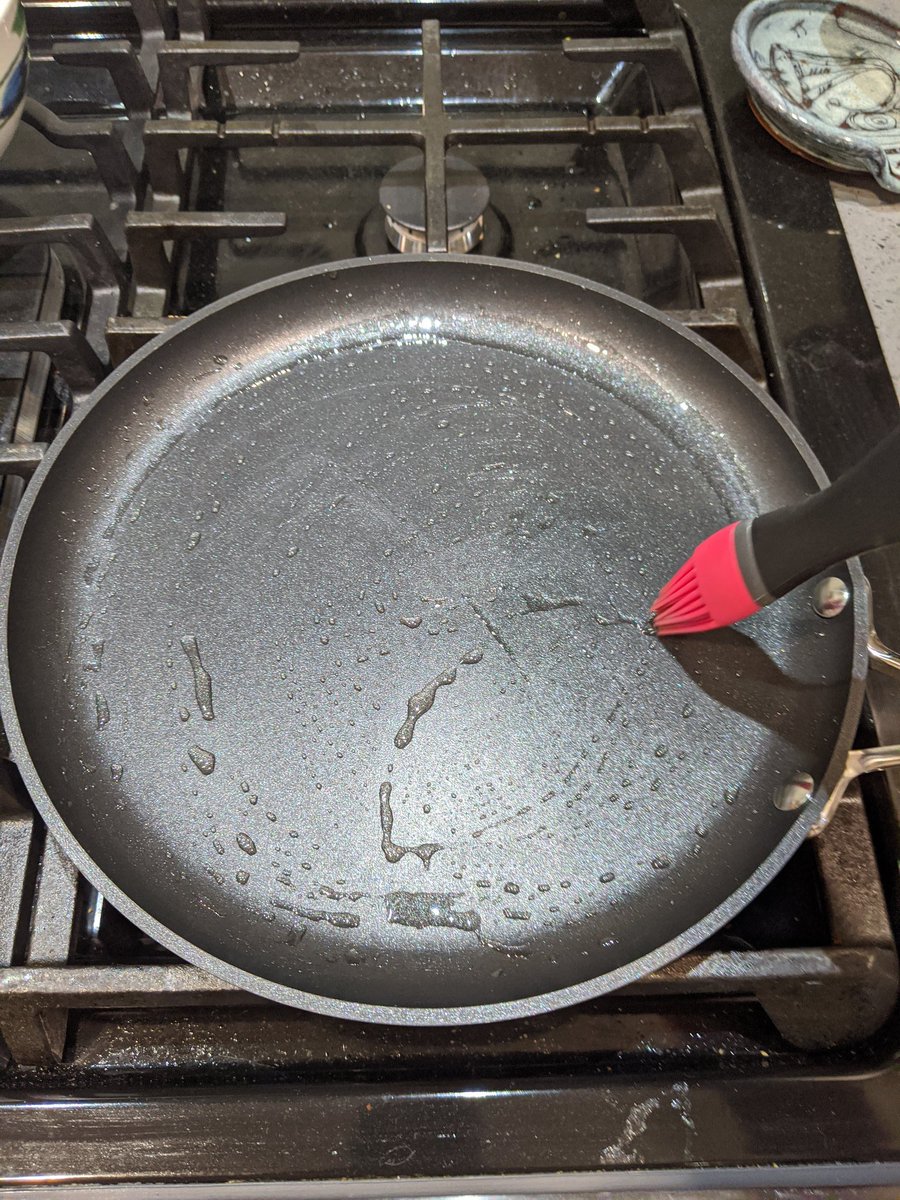 I like to use canola oil and a brush to very lightly oil my pan. Yes I know, a real Frenchman would use butter. Sue me.