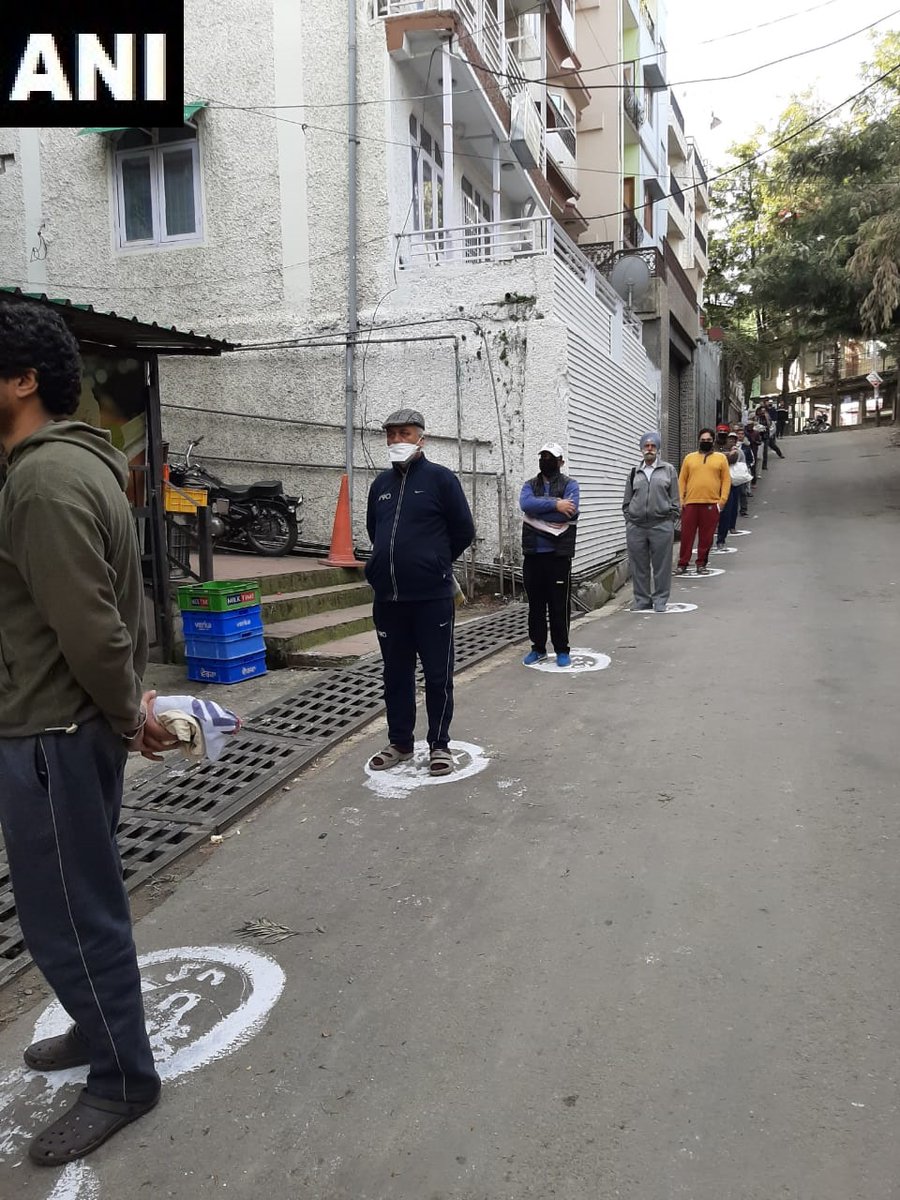 ANI's tweet photo. Shimla: People outside a shop stand at a distance from each other as they practice social distancing. #Coronavirus https://t.co/Ej0Hg2jRFu