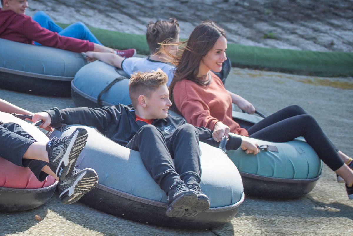 *Things to look forward to as soon as we are open again* 
😊
What are Sno-Tubes? They're large inflatable rings which can be spun and linked together to slide down the slopes. 
Photo credit artisanphotography.life