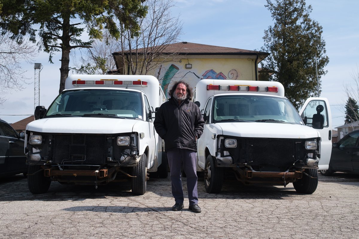  @guzmanyaderFather Hernan Astudillo stands in front of a pair of decommissioned ambulances donated by the city to Caravan of Hope, a non-profit Mr. Astudillo founded. The vehicles, loaded with donated medical supplies, will be sent to his native Ecuador to battle COVID-19.