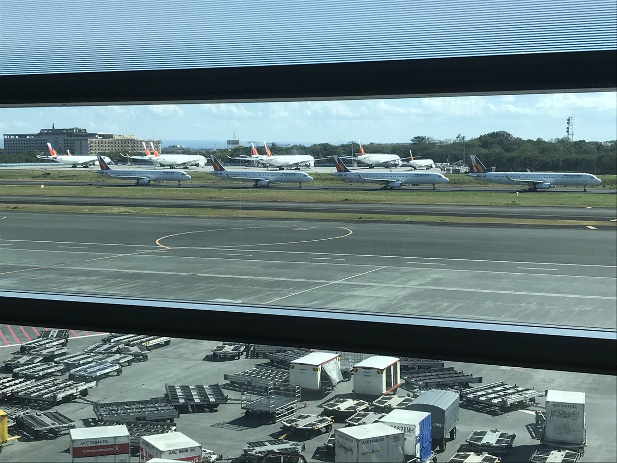 Britmorgblack's tweet photo. Listening to Todd’s story... here’s Philippines Air and Malaysia’s Air Asia grounded before i flew out of NAIA in Manila 😔 @MaxSweeten @sherilynch @HallerTodd https://t.co/a3KpUUT2xX