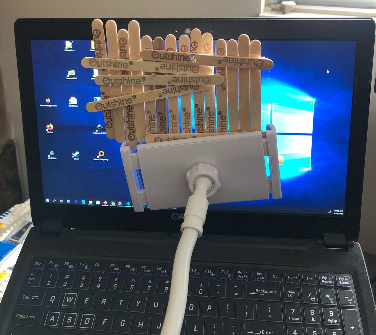 jtothebell's tweet photo. To keep it light at work, we've been having themed virtual meetings where you pick a background to match the theme and use Zoom's Virtual Background Feature. Today's theme was 90's Sitcoms, and I decided to use practical effects. #HiHoVirtualNeighbor https://t.co/KkCfoOSRn0