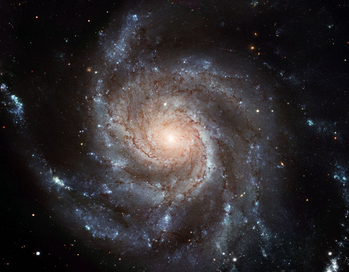 Anyway, the Pinwheel Galaxy (NGC 5457) is an example of a "grand design spiral." Where a flocculent galaxy is fluffy and patchy, a grand design spiral has well-formed arms sweeping out long arcs.Image: European Space Agency & NASA