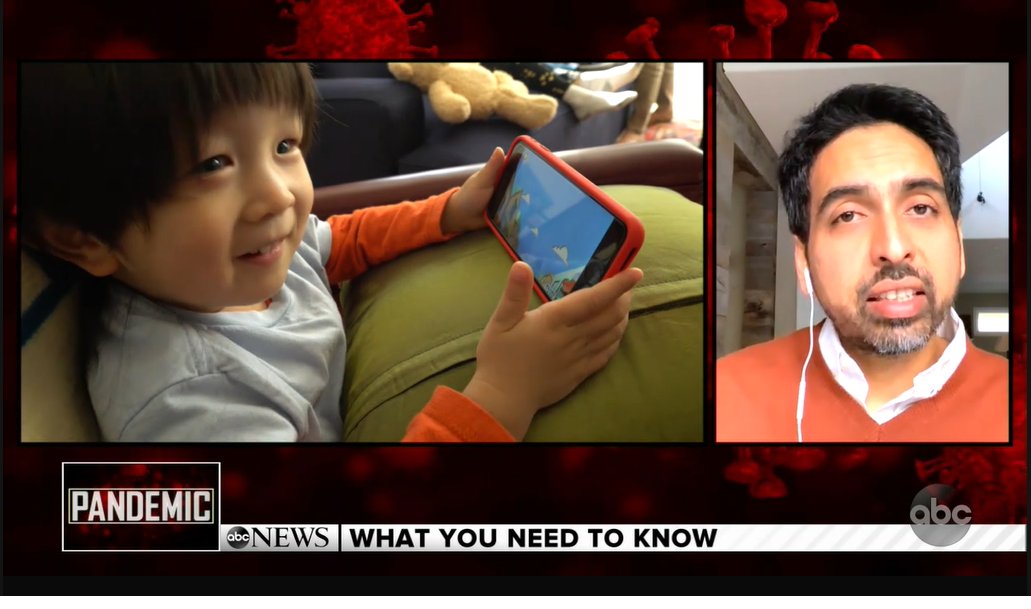 A split screen from the broadcast. On the left side a toddler smiles as he plays the Khan Academy kids app on a smart phone. Sal Khan is speaking in a screen on the right side.