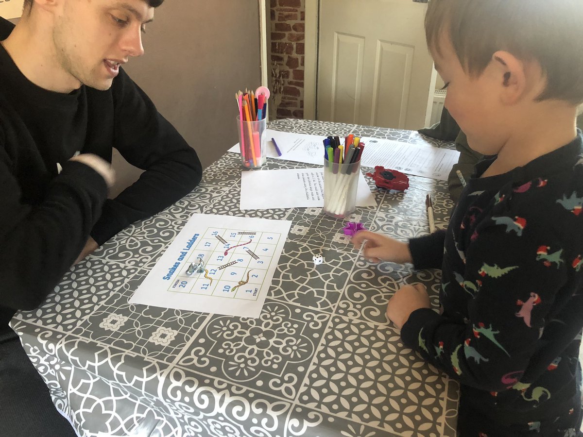 cecoley87's tweet photo. @WonderfulWrens Ellis playing snakes and ladders with Daddy, just after he’d played bingo,  he’s really enjoying the work packs sent home, thank you for the time you put into making them 😊 https://t.co/IamFe6oWC5