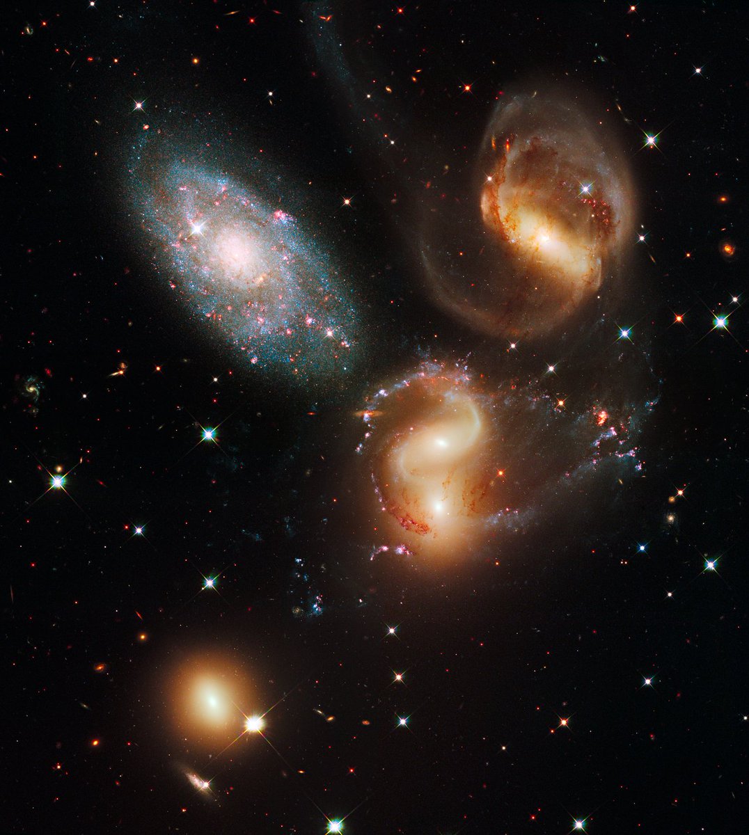 "Stephan's Quintet" in the constellation Pegasus isn't really a quintet. The galaxy in the upper-right corner of the image is only about 40 million light years away; the four others are about 300 million light years away.Image: NASA, ESA and the Hubble SM4 ERO Team