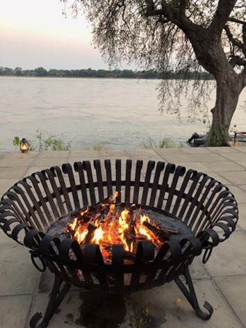 BainesRiverCamp's tweet photo. In Africa, evenings are generally warm but in the cooler months, we gather around the fire and share stories from the day. #ThinkBaines #ThinkZambia #WildAfrica #AfricanAdventure #Travel #Lifestyle #AfricanNature #Africa #Friday #Fire https://t.co/6hBIsG75Cf