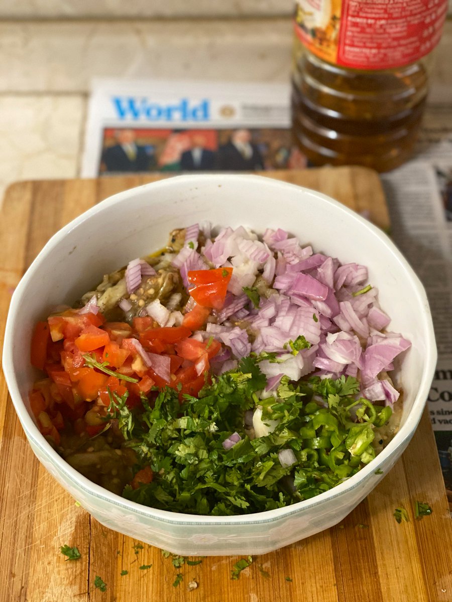  #Lockdown21 wala cookingDay 3Roasted bharta brinjal, peel and mashSmall onion and tomato, finely choppedGreen chili, 2 cloves garlic, coriander -finely choppedLime juice, salt, mustard oil.Mix well and let it sit for a couple of hours.Begun pora, my style.  #stcooks