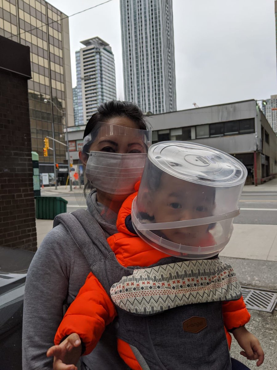 ta_melanie's tweet photo. What do you with babies who won’t wear a mask? You get creative. @LTAintheGTA mama and babe protected as they go for his vaccination. #Coronavirustoronto #COVID19 #staysafe #bettersafethansorry https://t.co/iHMkj1WOMF