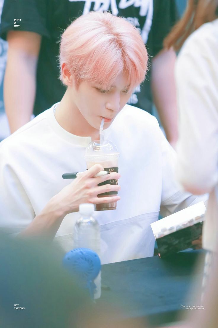 pink haired taeyong during cherry bomb era was really cute and he looked like a fluffy cotton candy