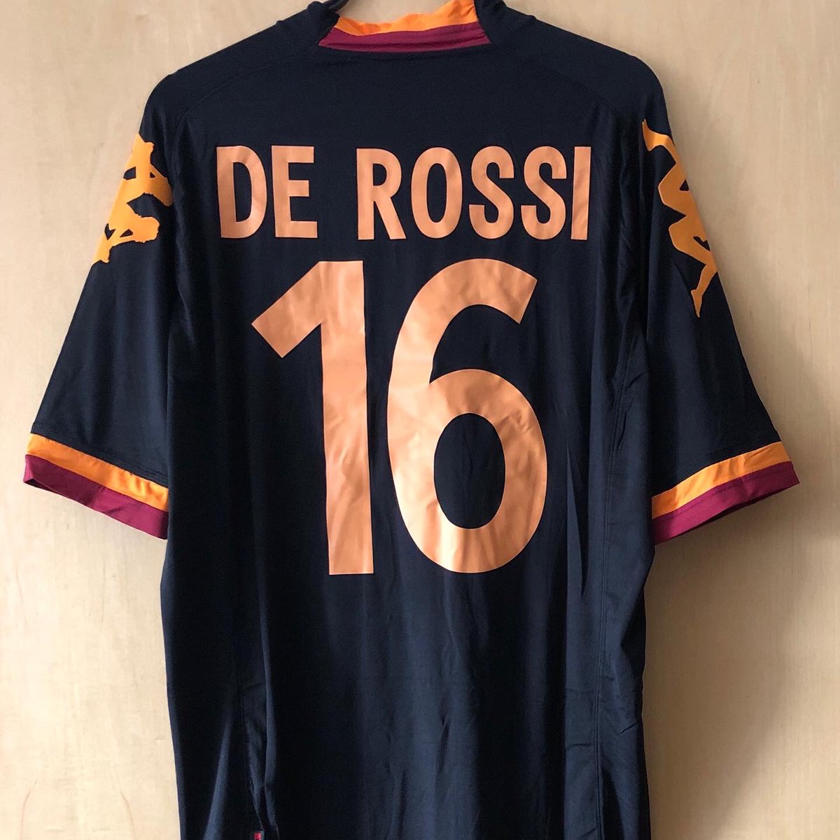 . @ASRomaENThird Kit, 2012/13 @Kappa_UKPersonalised: De Rossi, 16Damn extra-tight Kappa shirts. But I’m a sucker for Roma’s blue or black shirtsI got this one the day after De Rossi announced his departure from Roma, one of my favourite players ever #FootballShirtCollection