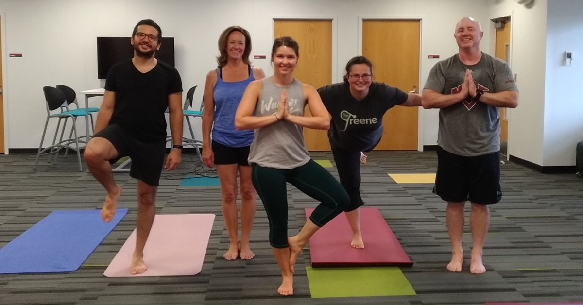 ASSISTCenter's tweet photo. #FlashBackFriday to our ASSIST Active crew + our @FREEDMerc friends doing yoga (@NCStateWellRec). #SoZen #PackinAction https://t.co/Pz4gagrCh8