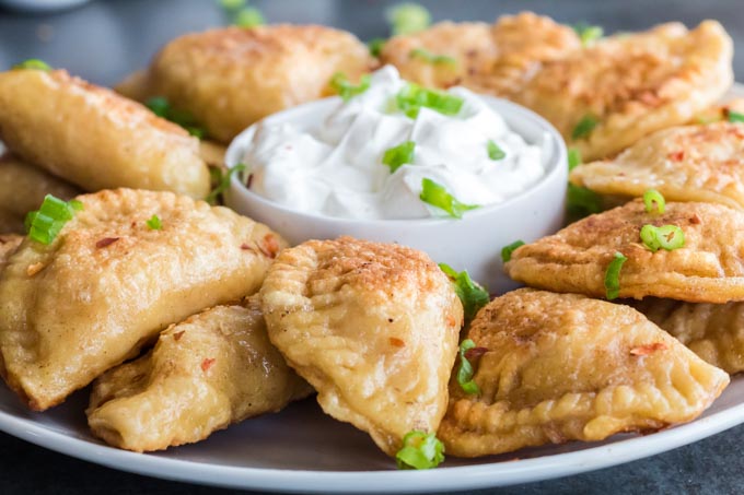 This homemade pierogi recipe has been in my family for generations. Today I am sharing it with you. bit.ly/39hbSW4 #pierogi #dumplings #recipe #Polishfood