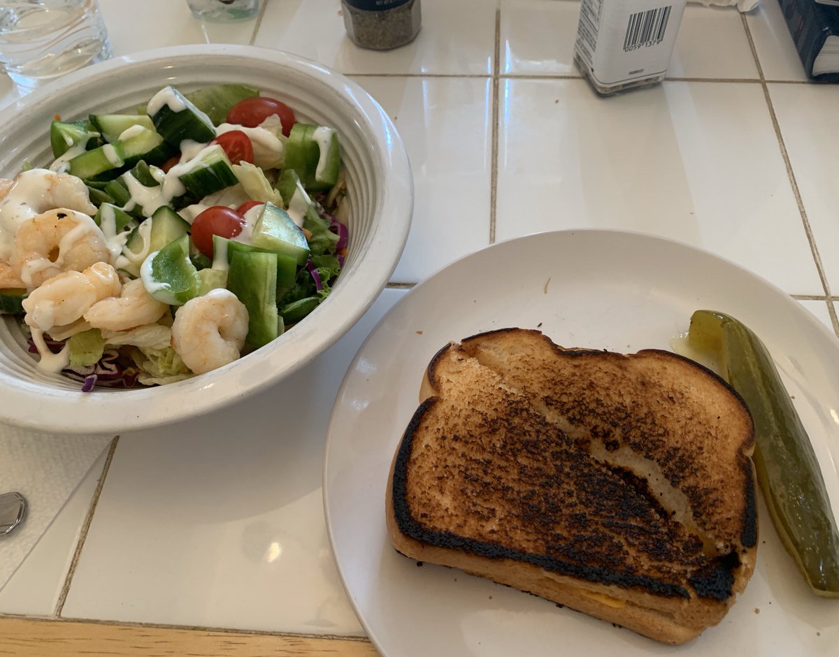 Slightly burnt grilled cheese with a very not-burnt salad with shrimp.