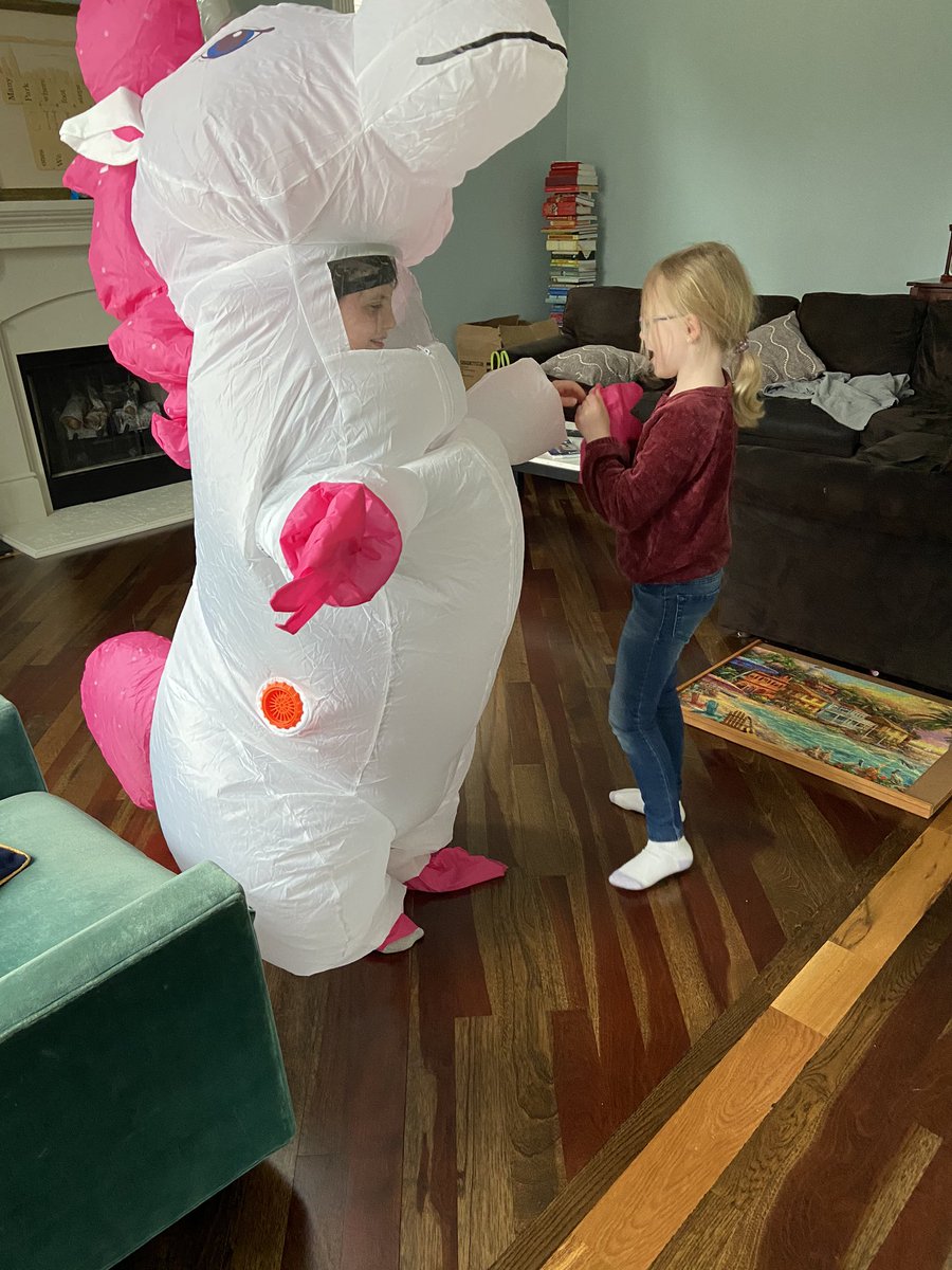 KateKirley's tweet photo. My kids working together to don and doff the unicorn properly #PPE? https://t.co/szfIcQX8xe