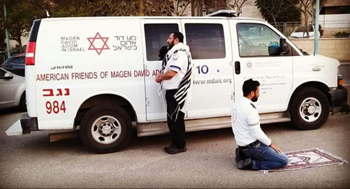 ianbremmer's tweet photo. Two Israeli medics praying during a break in their shift.

One Jewish.
One Muslim.
Shared humanity.

Ht @YKleinHalevi https://t.co/M7WzzRcKPO